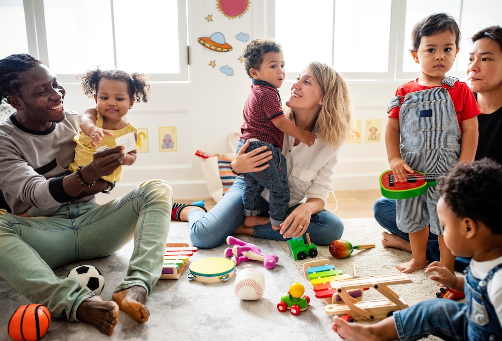 Toddlers exploring instruments in a music class